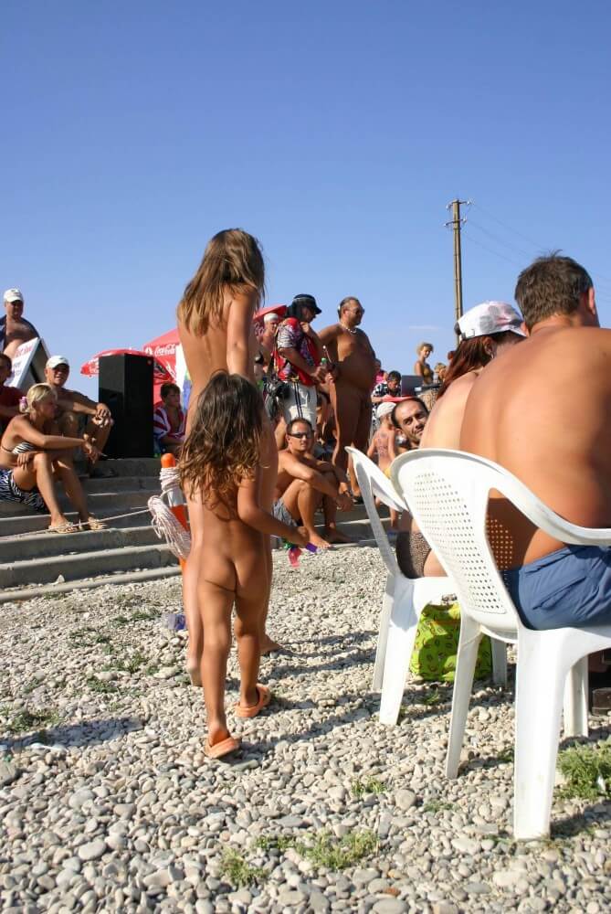 Naturist Standing Sideline - Naturism implies a life free of unnecessary problems