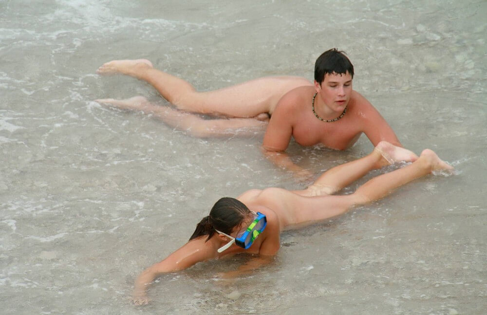 Wading In The Shallows pics - Harmony and balance are important in this nudist culture