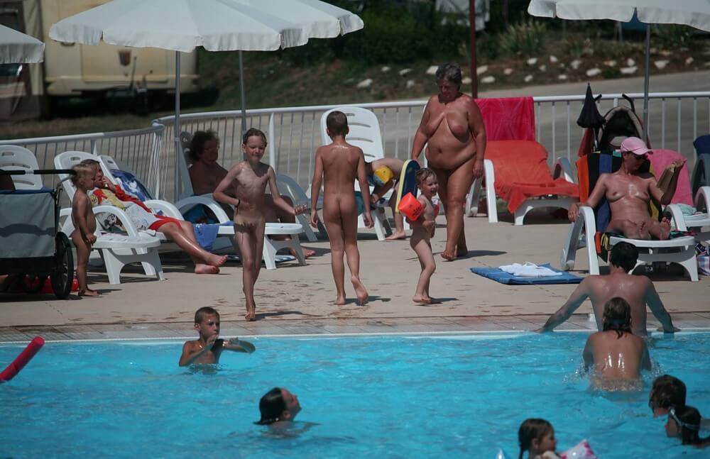 Naturist Afternoon Pool Games pics - Getting rid of clothes