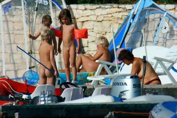 By the boat photos - A nudist values trust and friendliness among people