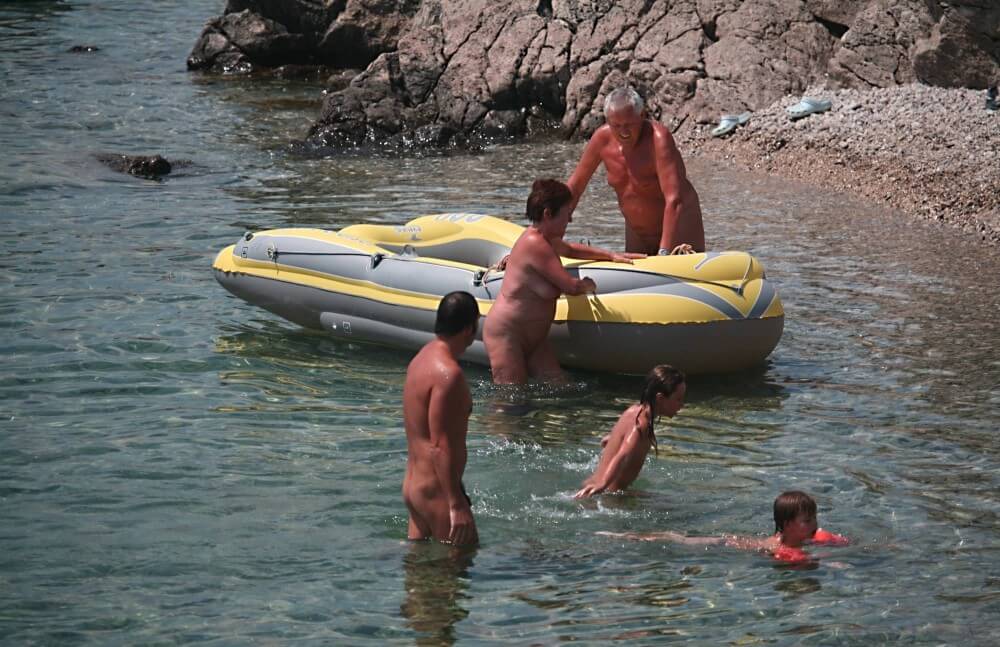 Lone Nudist in Yellow Boat photos - The concept of being without clothes
